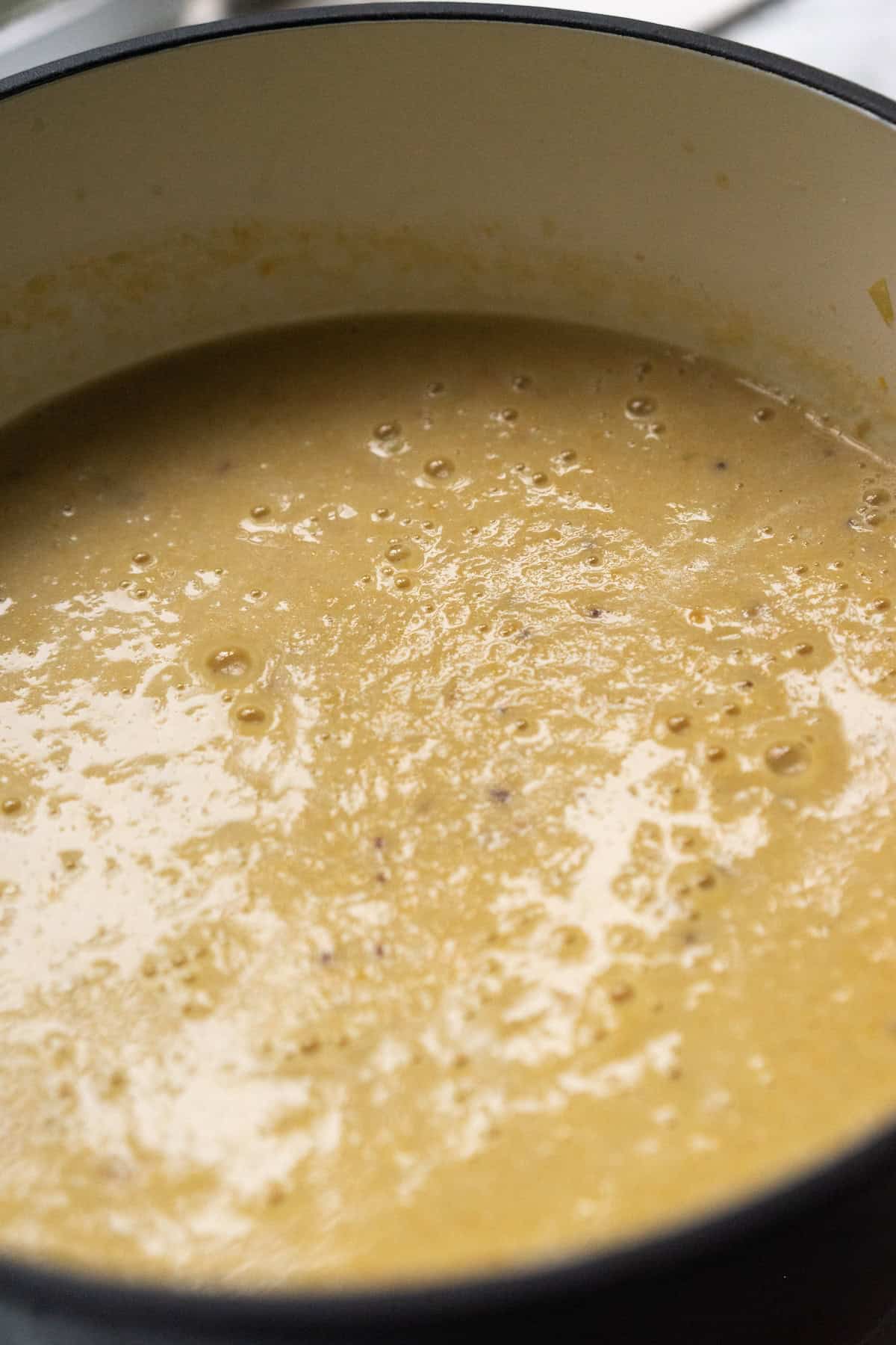 Creamy chicken soup in pot