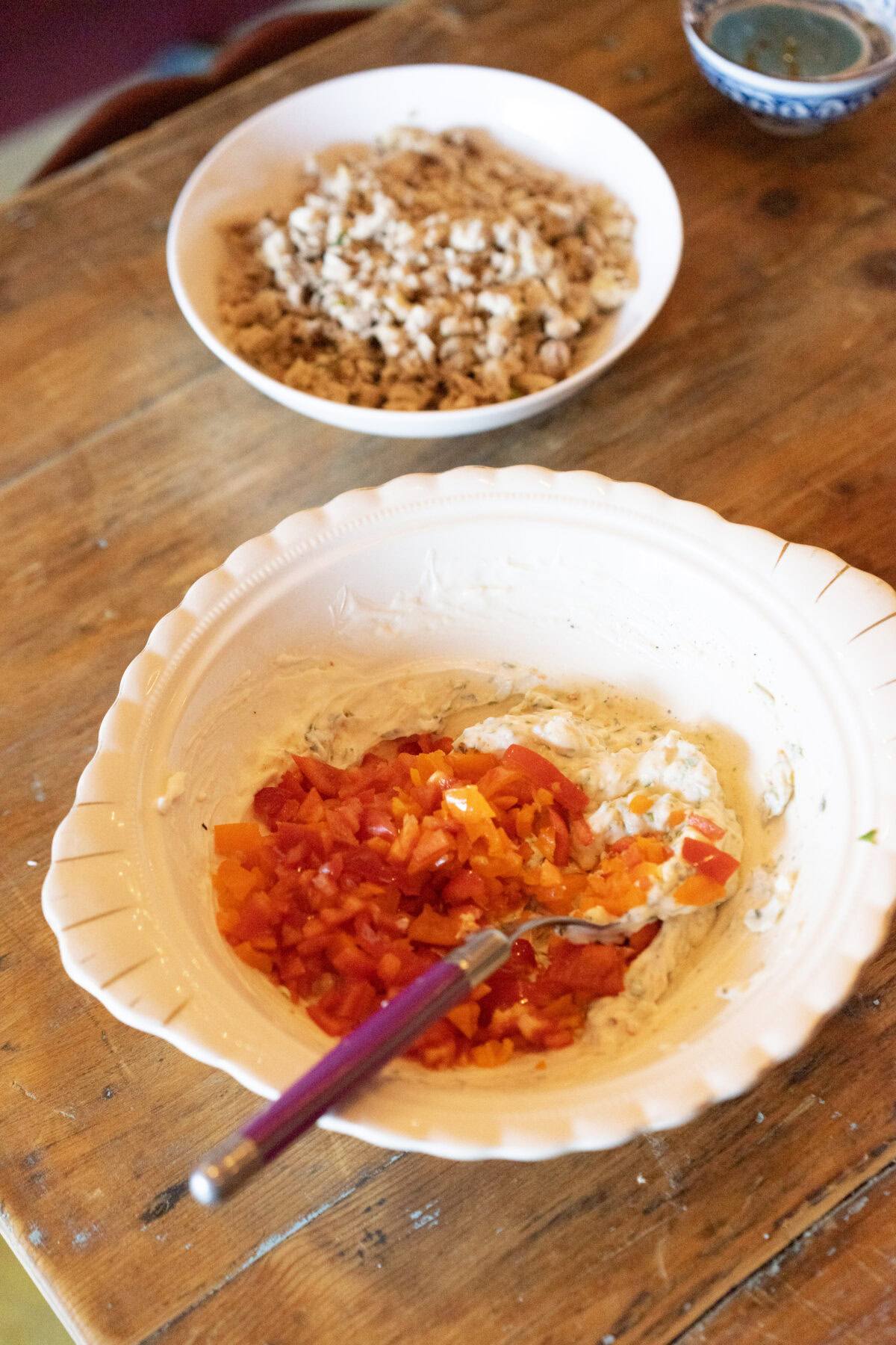 folding peppers into chicken salad base